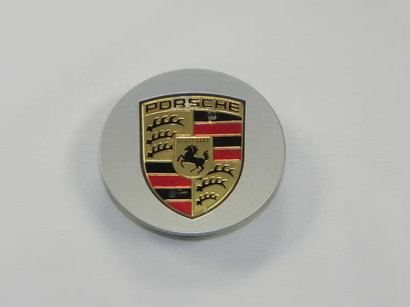 (Damaged) Boxster/Cayenne/Cayman/Panamera Plastic Center Cap W/ Colored Crest 1