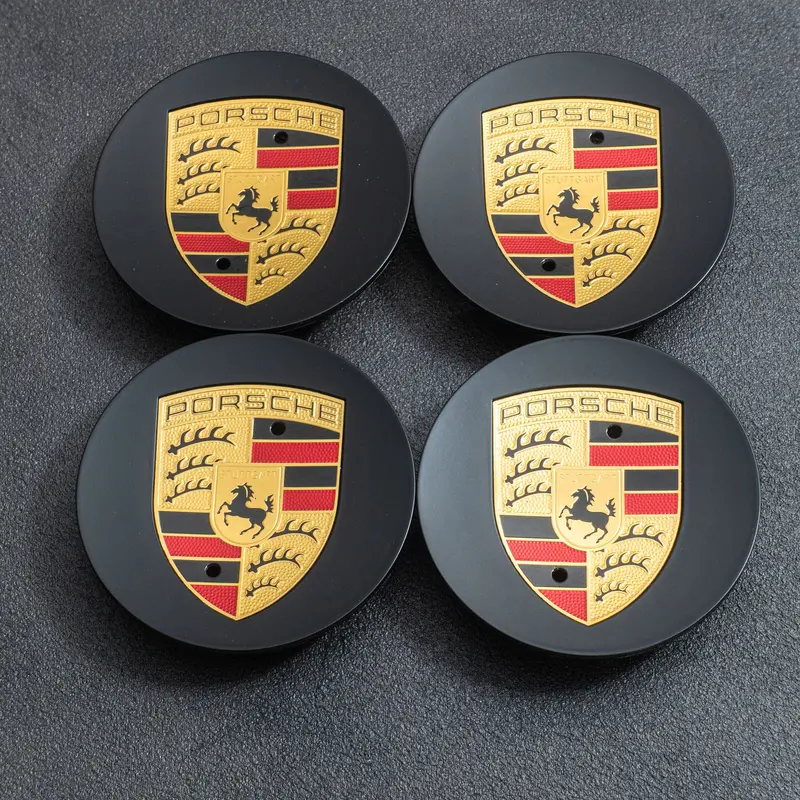 (New) 718 Cayman Gt4/Spyder Black Colored Crest Hubcap Set 1
