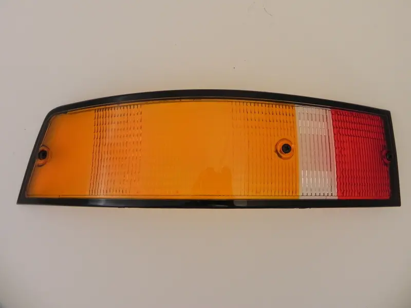 (New) 911/912/930 Genuine Left Side Euro Amber/Red/Clear Tail Light Lens With Black Trim - 1973-89 1