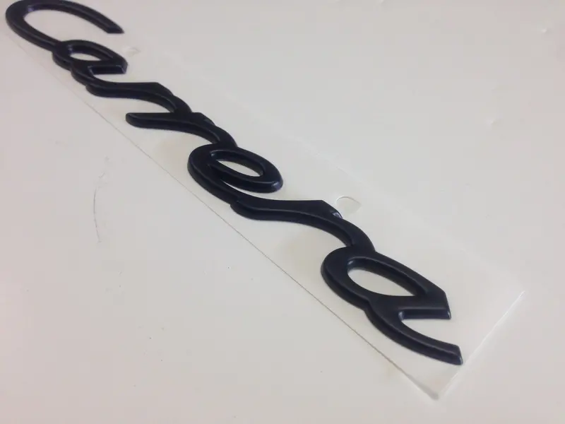 (New) 911 Black "Carrera" Rear Engine Lid Emblem - 1994-98 2