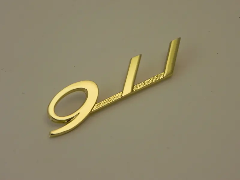 (New) Gold 911 Glove Box Emblem - 1965-66 1