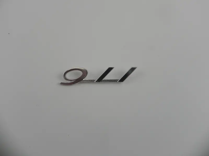 (New) Silver 911 Glove Box Emblem - 1965-66 1