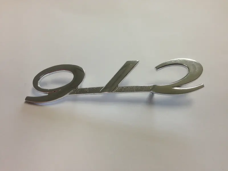(New) Silver Engine Lid 912 Emblem - 1965-66 1